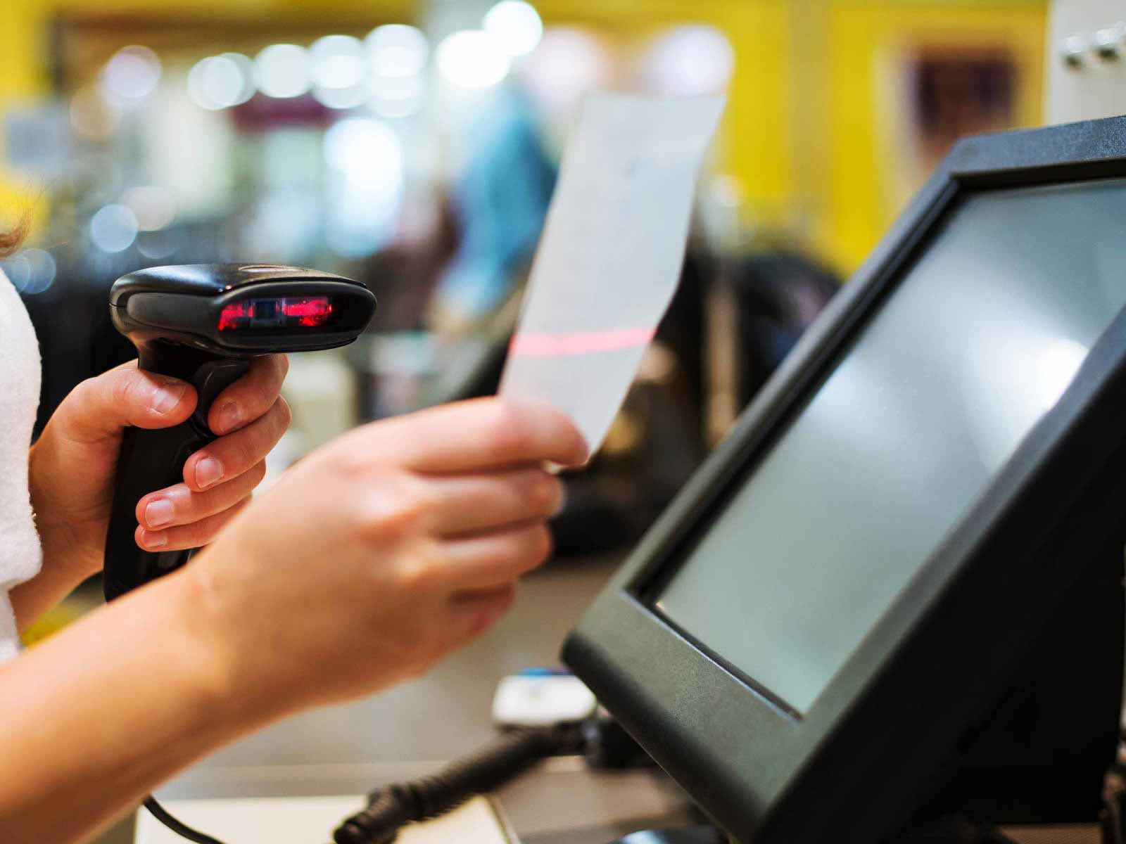 Cashier using a POS system