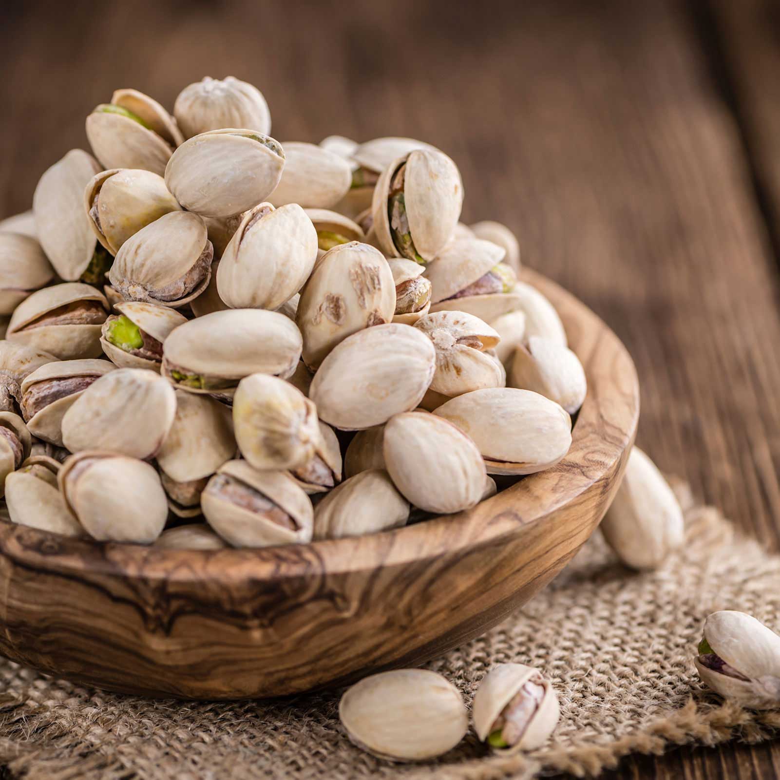 A bowl full of pistachios.