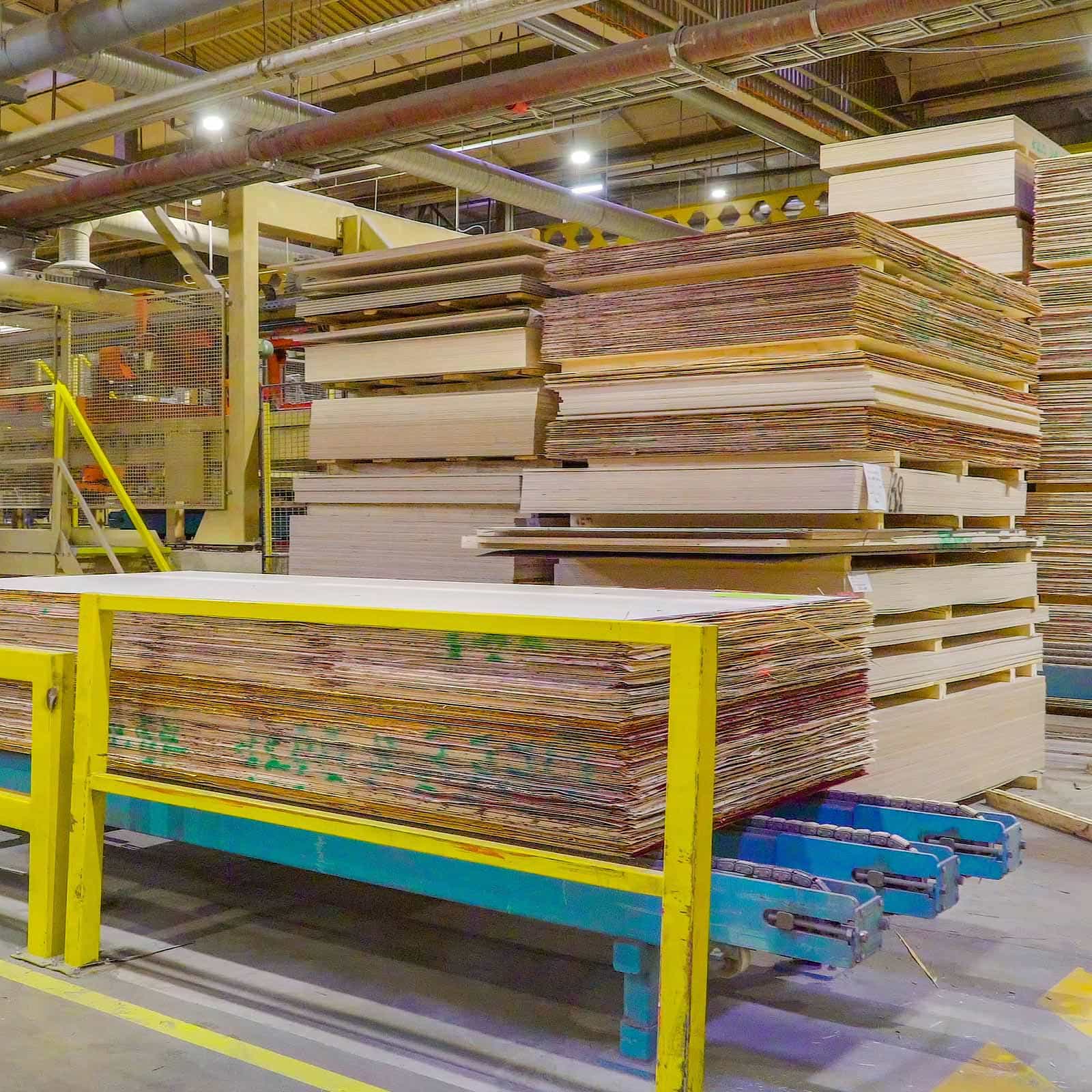 Plywood stacked in a manufacturing facility