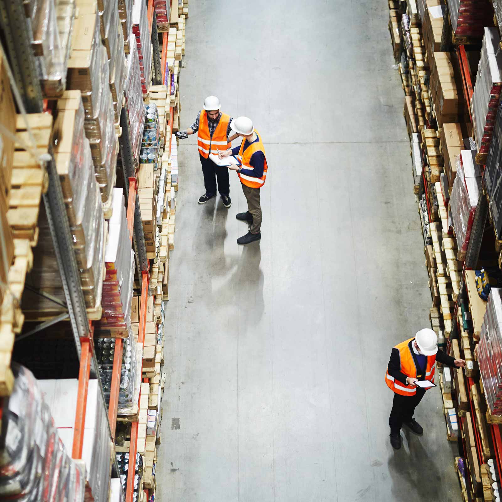 Workers performing a year-end inventory count in the warehouse