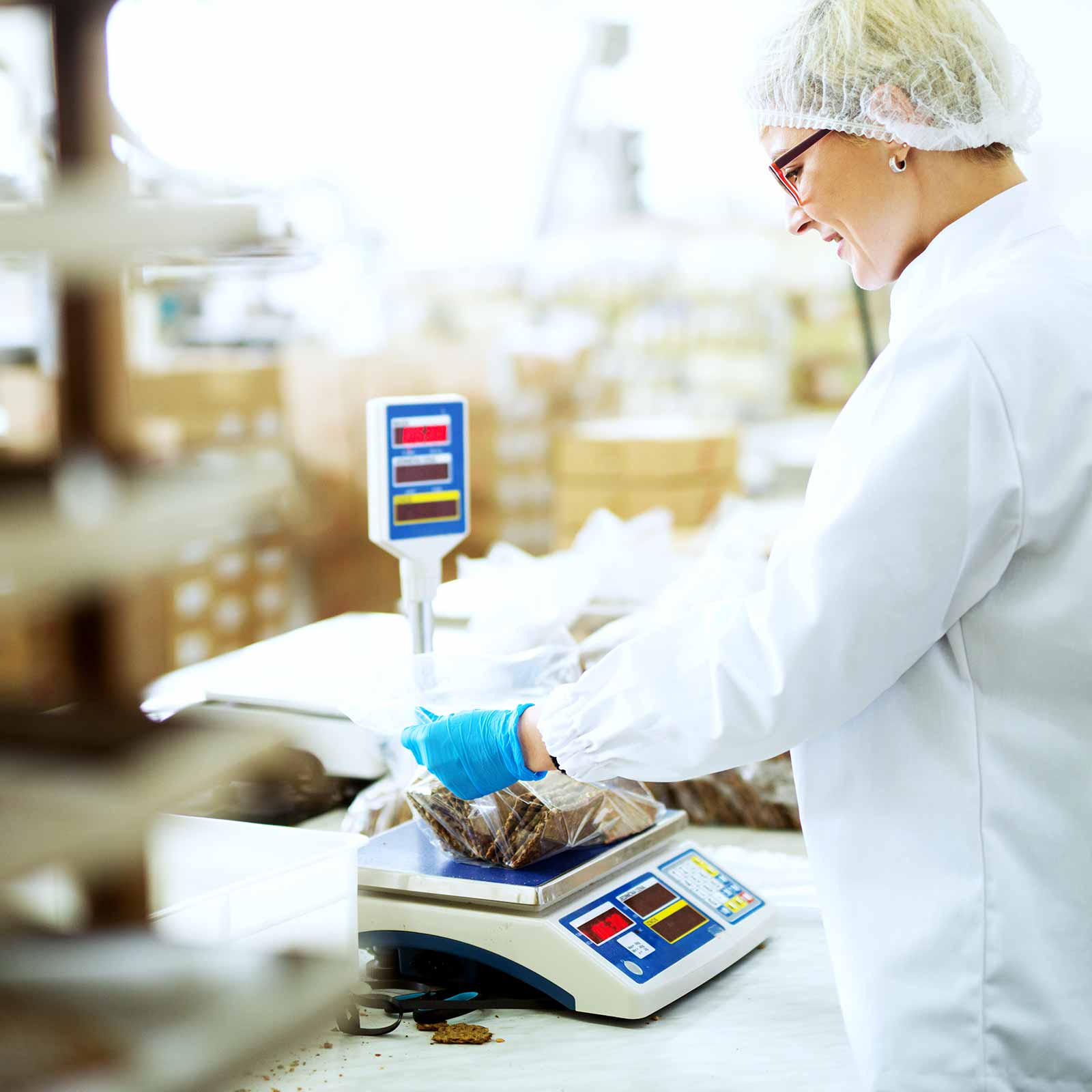 production worker weighing materials